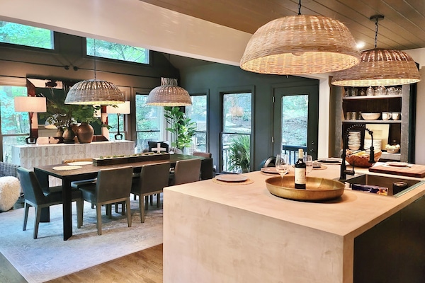 Beautiful micrcrete kitchen island viewing into luxurious RH dining room
