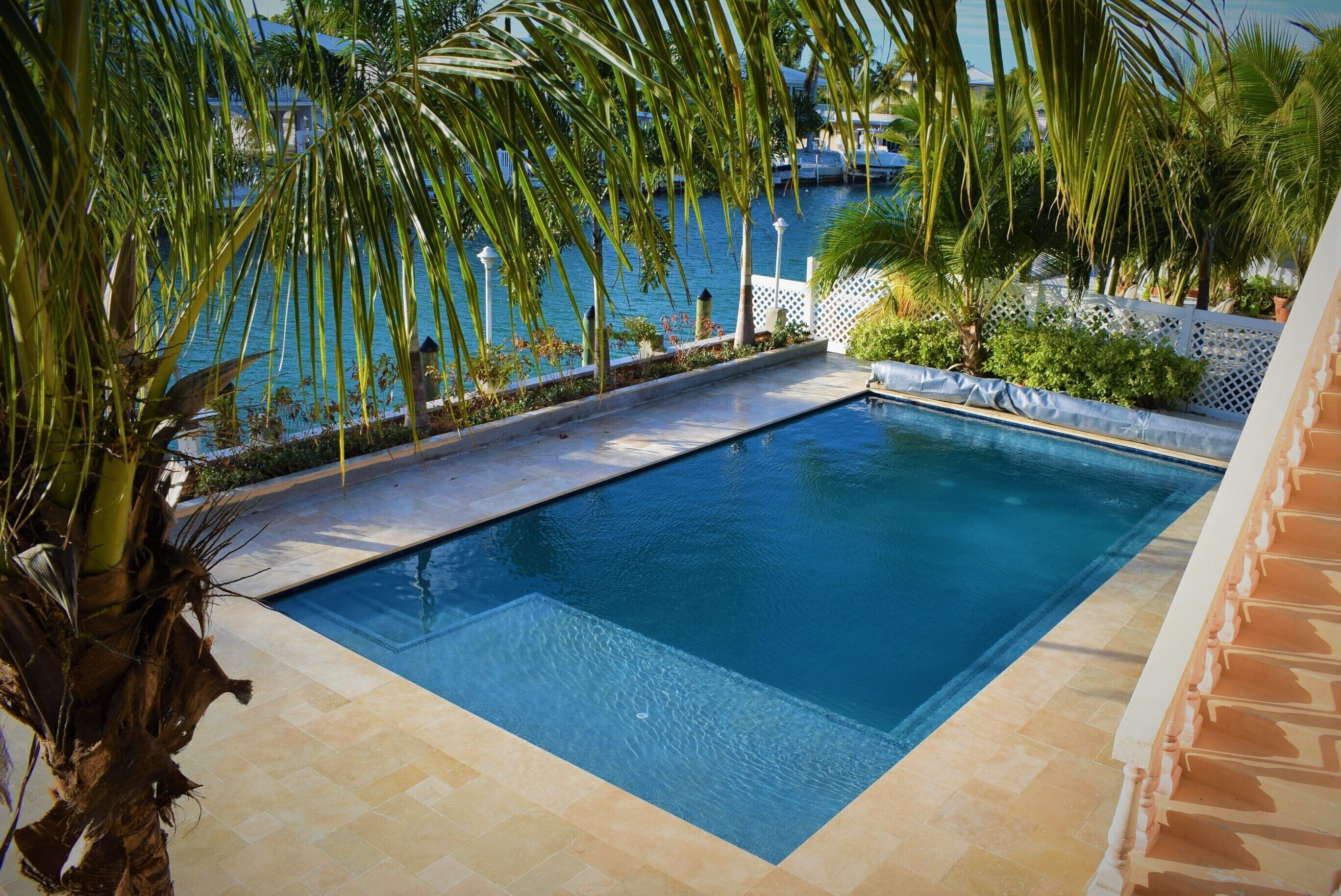 LUXURY WATER FRONT SINGLE FAMILY, LARGEST HEATED POOL, TIKI HUT, AND 75’ DOCK