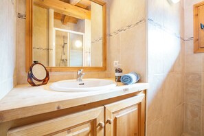 Bathtub, hair dryer, towels, soap