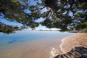 On the beach, sun loungers, beach towels