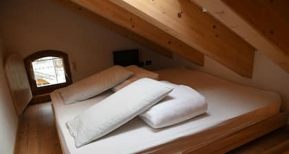 Room with mezzanine in Canazei