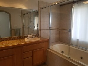 Bathtub, jetted tub, hair dryer, towels
