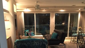 A living room with a sofa, a chair, a small table, and a blue trash bin. - !!!!!!  LA JOLLA DEL MAR ROSARITO SHORES. !!!!! (Playas Rosarito)