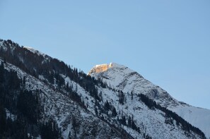 A snow-covered mountain with a clear sky. - Recently renovated venue with last minute booking discounts through the summer. (Kaprun)