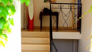 A staircase with a metal railing leading to a second-floor landing. - Holiday Home with Large Private Pool And Hill Views In The Heart Of The Dordogne (Condat-Sur-Vézère)