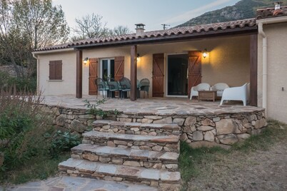 Detached villa with magnificent views, large pool, and terraces.