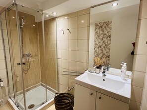 Shower, hair dryer, towels, soap