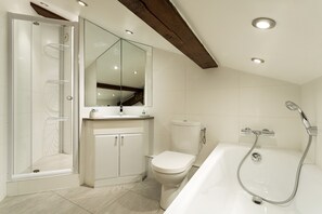 Bathtub, hair dryer, towels, soap