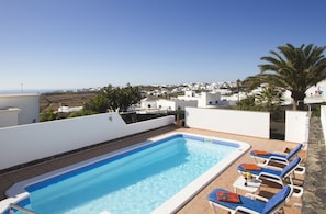 View of pool deck from upper patio