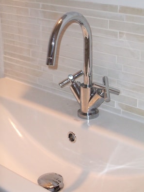 Combined shower/tub, hair dryer, towels, toilet paper