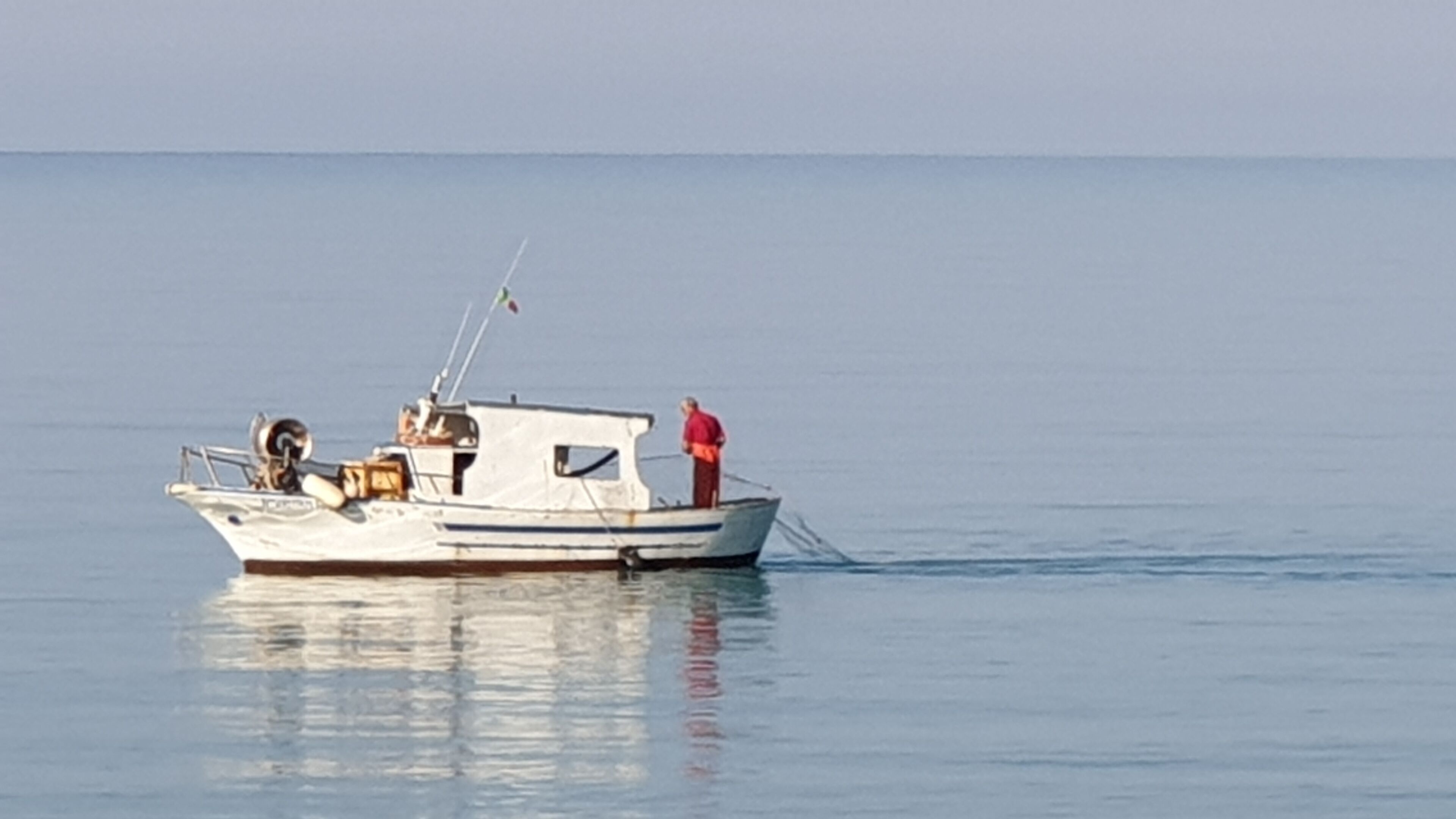 A small boat on calm water.