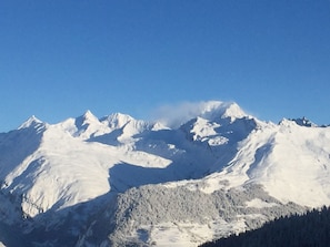 A snow-covered mountain range with clear skies.
