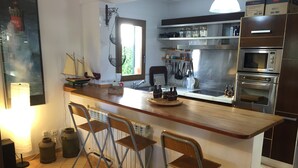 Private kitchen - Villa with pool, terrace, sea, countryside and sun. (Cala Pi)