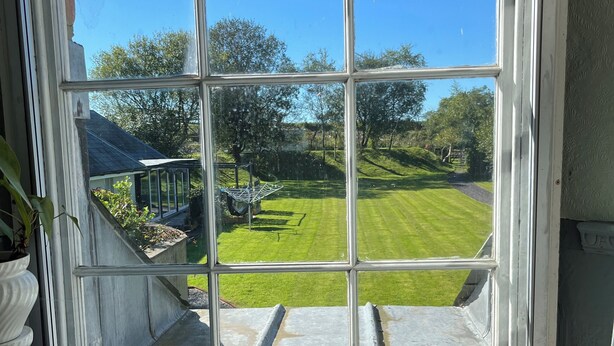 A window with a view of a green lawn and trees. - Detached Period Home-Former Rectory, Views Of Bristol Channel/Gower & Caldy (Narberth)