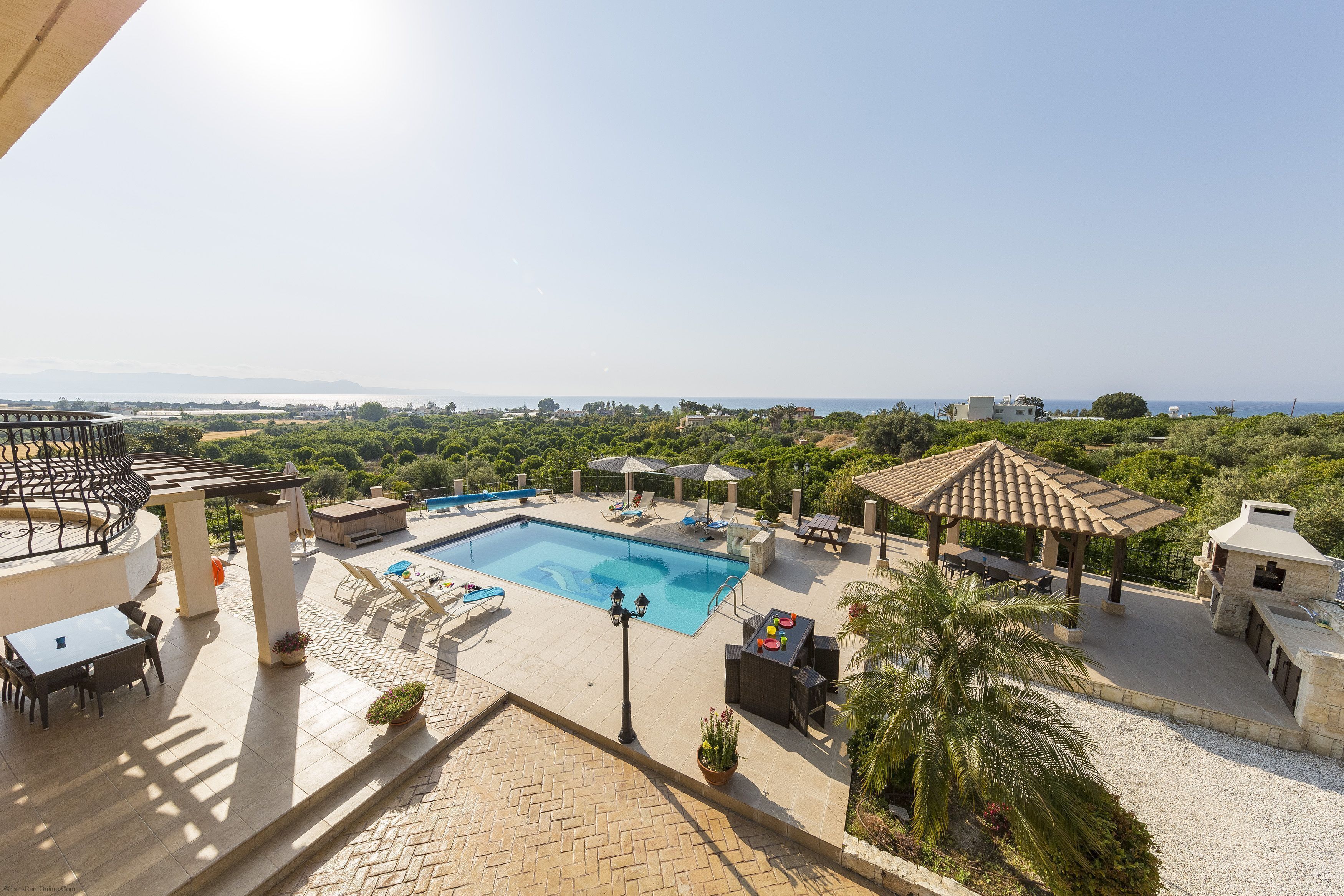 A heated pool, pool loungers