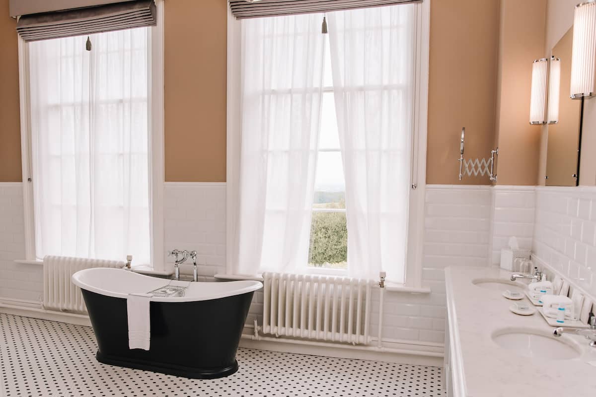 designer toiletries, hair dryer, bathrobes, slippers