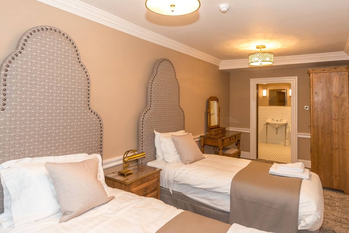 family suite | premium bedding, desk, laptop workspace, blackout curtains