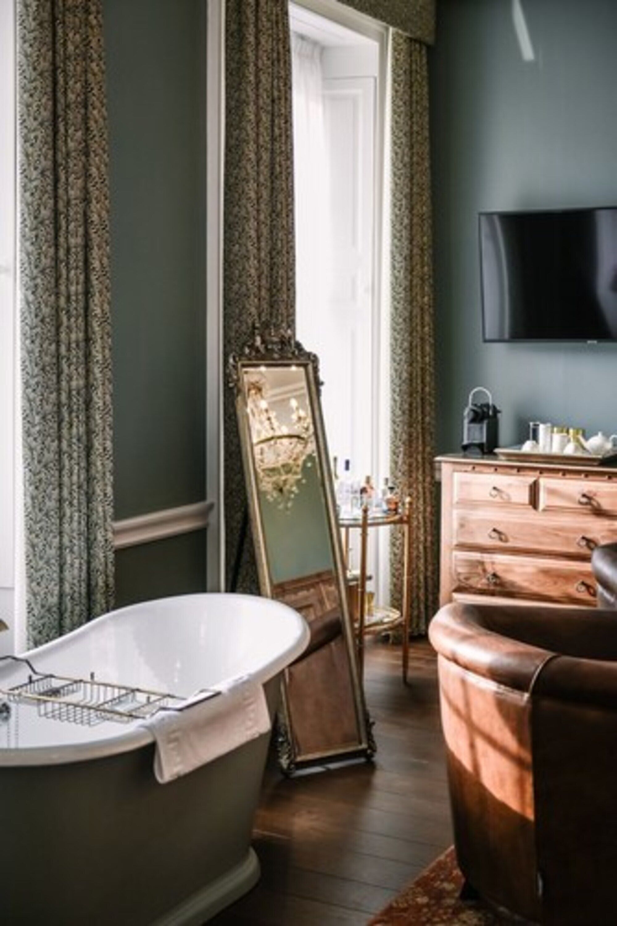 luxury suite | premium bedding, desk, laptop workspace, blackout curtains