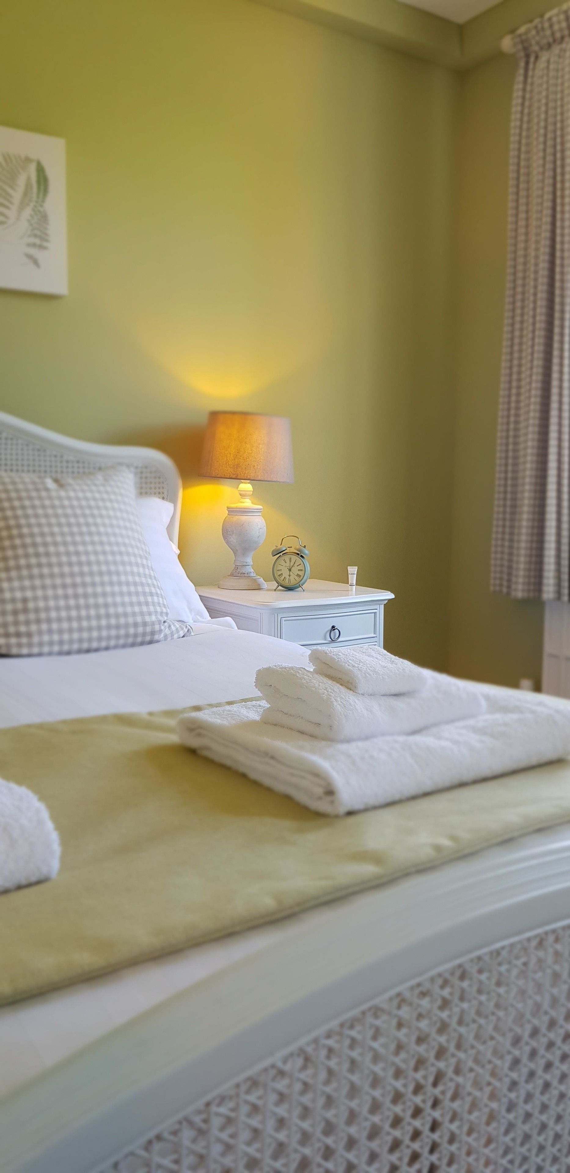 Premium bedding, desk, laptop workspace, blackout curtains