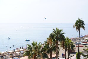 On the beach, sun-loungers