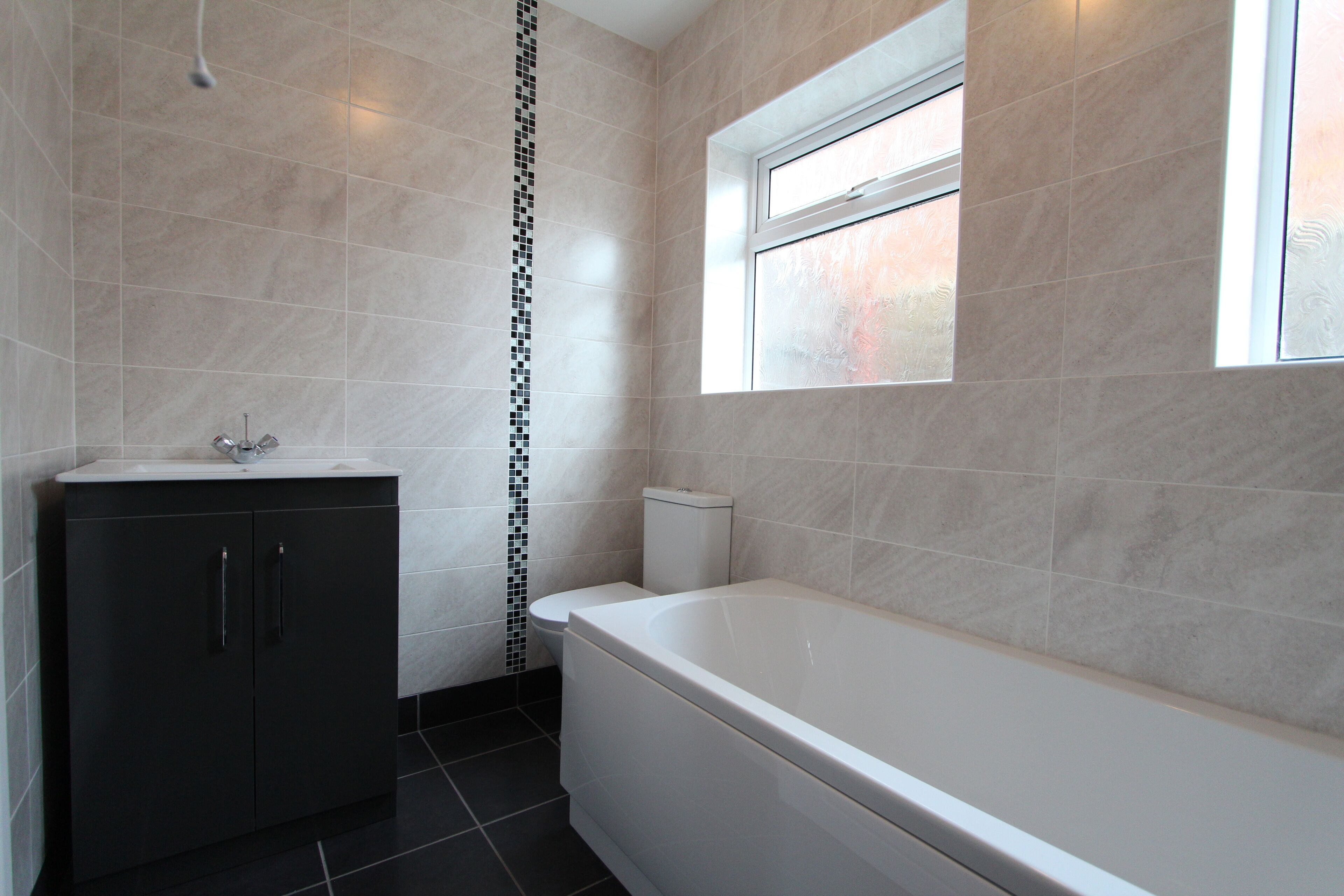 Bathtub, hair dryer, towels, soap