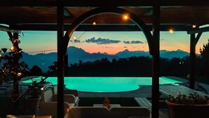 A covered outdoor area with a pool, seating, and a view of mountains. - Barga -cottage & barn 6 hctres of land, private pool, WIFI , stunning views! (Barga)