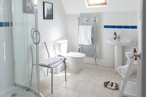 Combined shower/bathtub, hair dryer, towels, soap