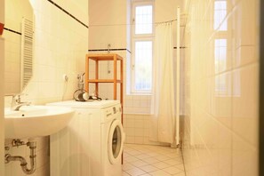 Combined shower/bathtub, hair dryer, towels, toilet paper