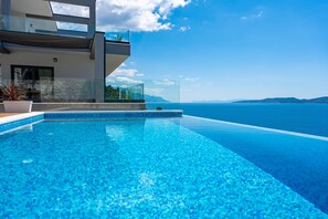 Outdoor pool, an infinity pool - Luxury beachfront VILLA HRID, with Jacuzzi, heated infinity pool with massage (Mimice)