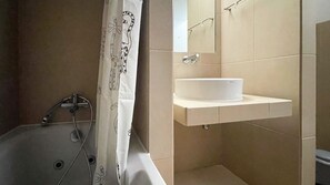 Bathtub, hair dryer, towels