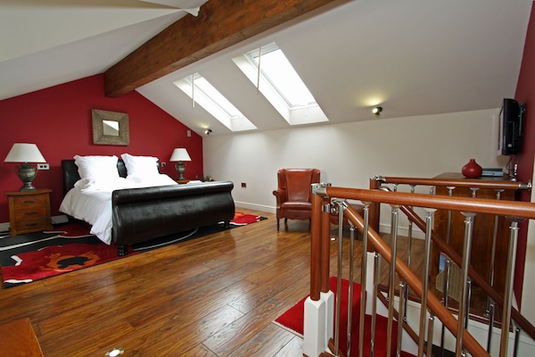 Luxury King-size bed in a very spacious bedroom!