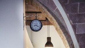 A narrow hallway with a clock, pendant light, and a sign that reads "Cuisine". - La Casetta, Casole d'Elsa, Siena. Join the real Tuscany countryside! (casole d'elsa siena)