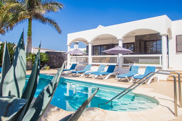 Outdoor pool, a heated pool, pool loungers