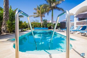 Outdoor pool, a heated pool, pool loungers