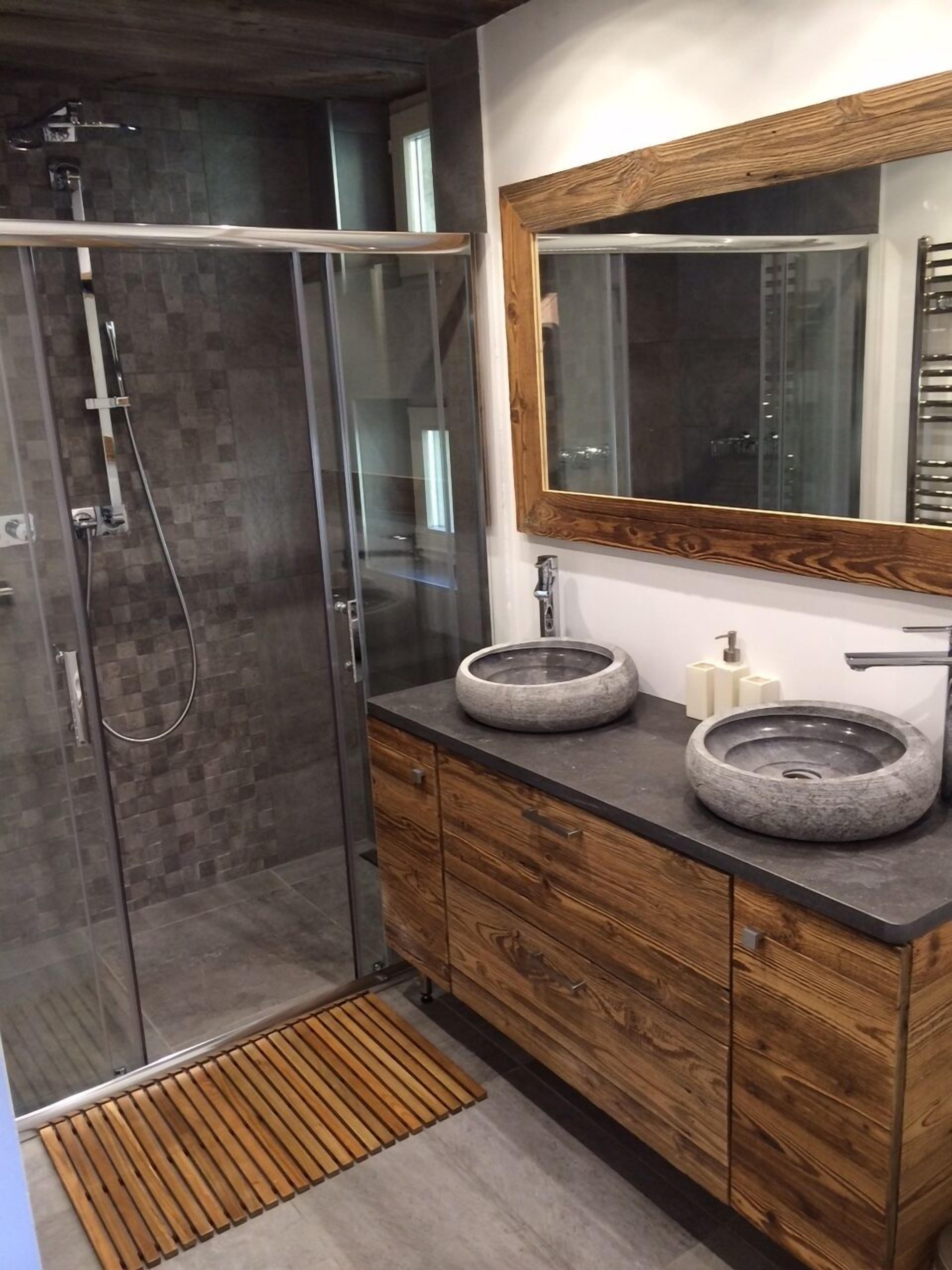 Bathtub, hair dryer, towels, toilet paper