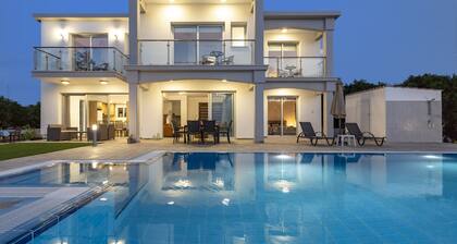 Villa Ammoyiali on the Beach - a large modern villa that sleeps 8 guests in 4 bedrooms