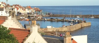 Stylish fisherman's cottage in heart of pretty harbour village, pet-friendly.