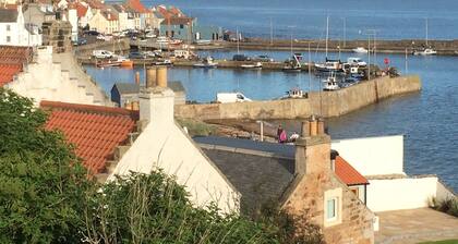 Stylish fisherman's cottage in heart of pretty harbour village, pet-friendly.