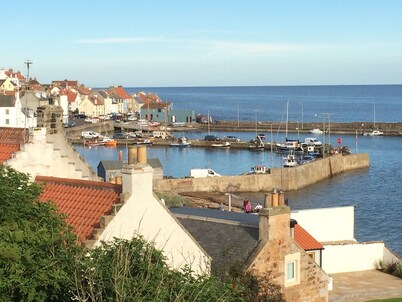 Stylish fisherman's cottage in heart of pretty harbour village, pet-friendly.