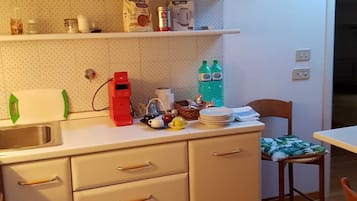 Fridge, coffee/tea maker, cookware/dishes/utensils