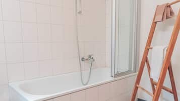 Combined shower/tub, hair dryer, towels, soap