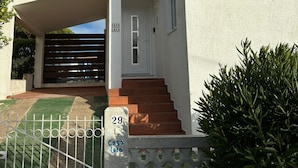 A white building with a tiled roof, a small window, and a door labeled "Casa Lala." - 2-bed Villa with Private Pool and Panoramic Views in a quiet residential area (Lagos)
