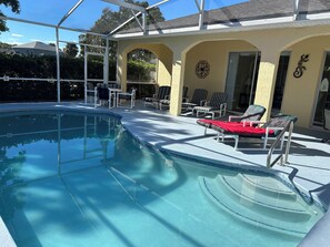 Outdoor pool, a heated pool, sun loungers