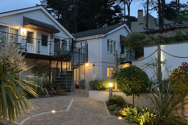 The apartment & courtyarden garden, fully lit after dusk.