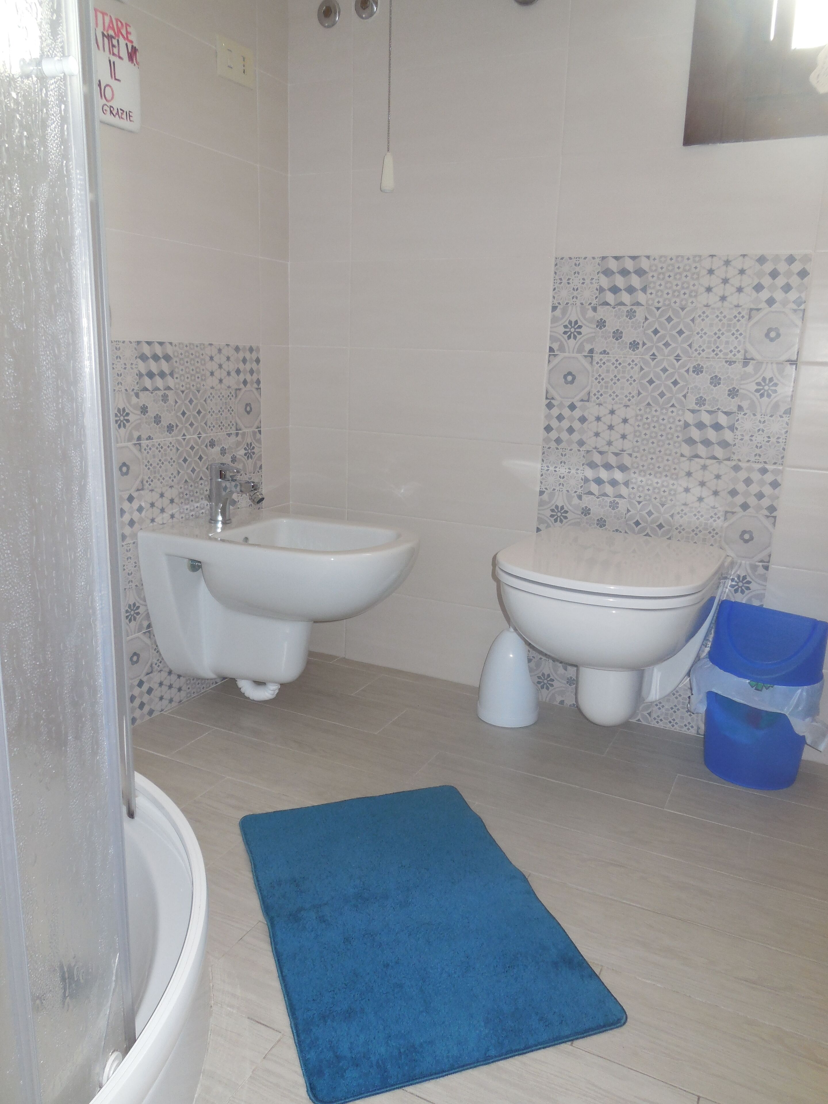 A bathroom with a bathtub, a bidet, and a toilet.