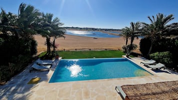 Outdoor pool, a heated pool, pool loungers