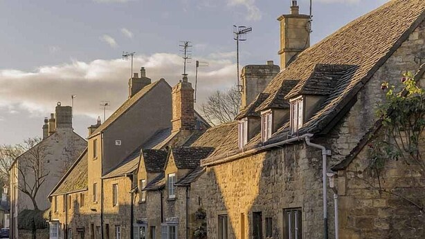 A row of stone buildings with pitched roofs and chimneys, typical of a historic village setting. - Boutique cottage in a quiet corner of Chipping Campden, a Cotswold gem. (Chipping Campden)