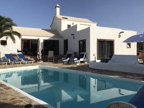 Outdoor pool, a heated pool, sun loungers