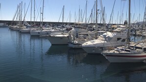 A marina with multiple sailboats docked. - A Wonderful Frontline Villa to Watch the Boats Go By! (Yaiza)