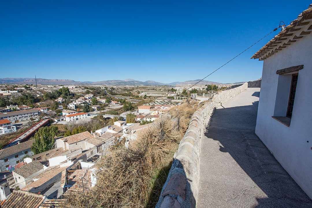 A view of a town with buildings and a clear sky.